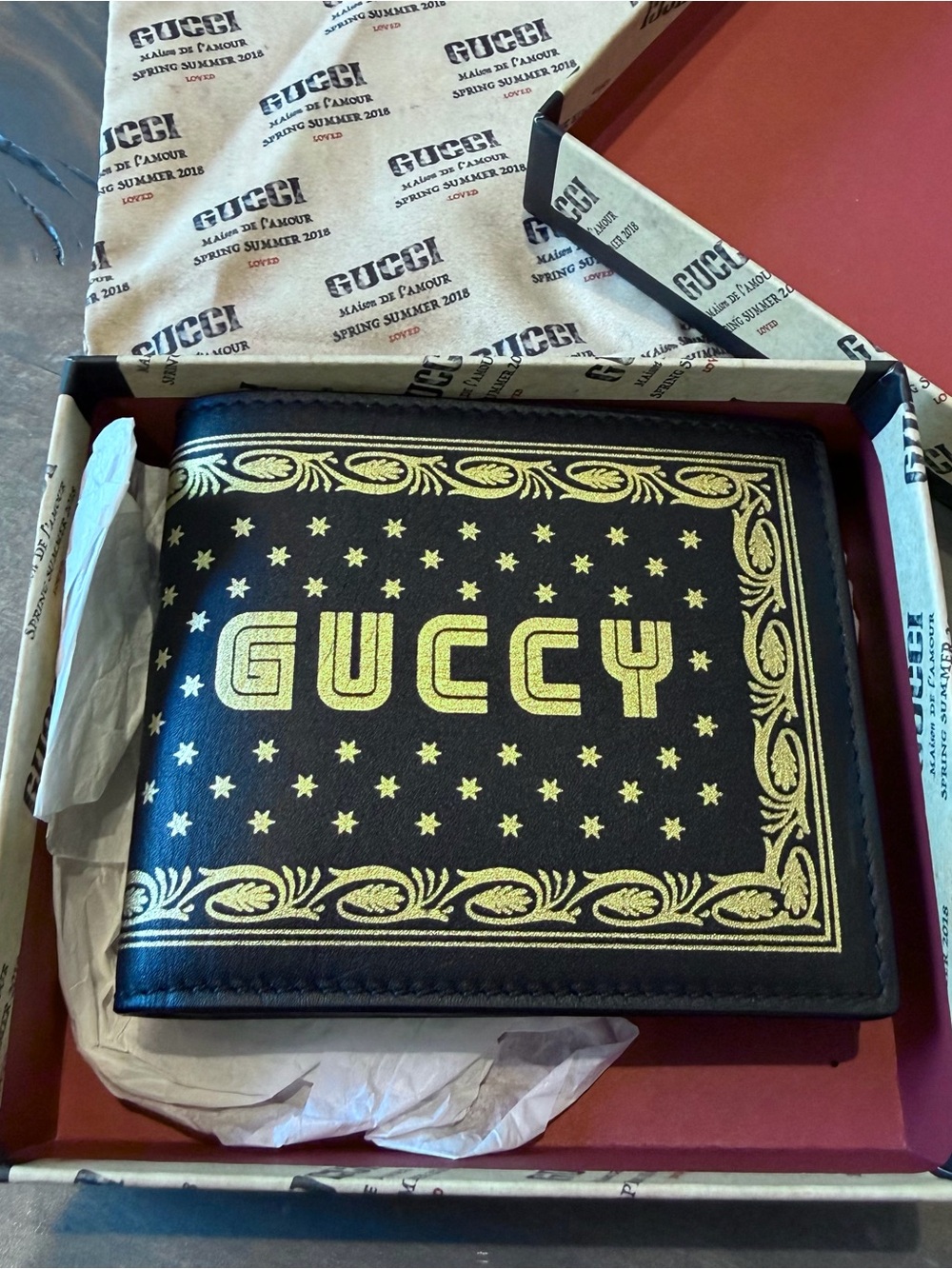 Gucci Black and Gold 'GUCCY' Leather Bi-Fold Wallet